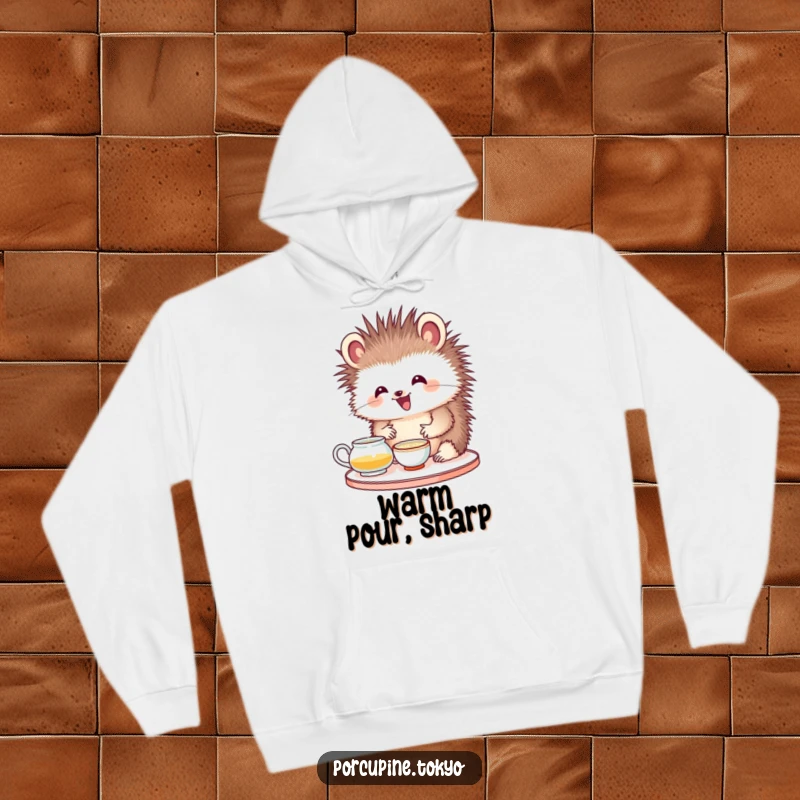 Funny hoodie showcasing a porcupine with a delighted expression, engaged in a tea ceremony, offering warmth and humor.